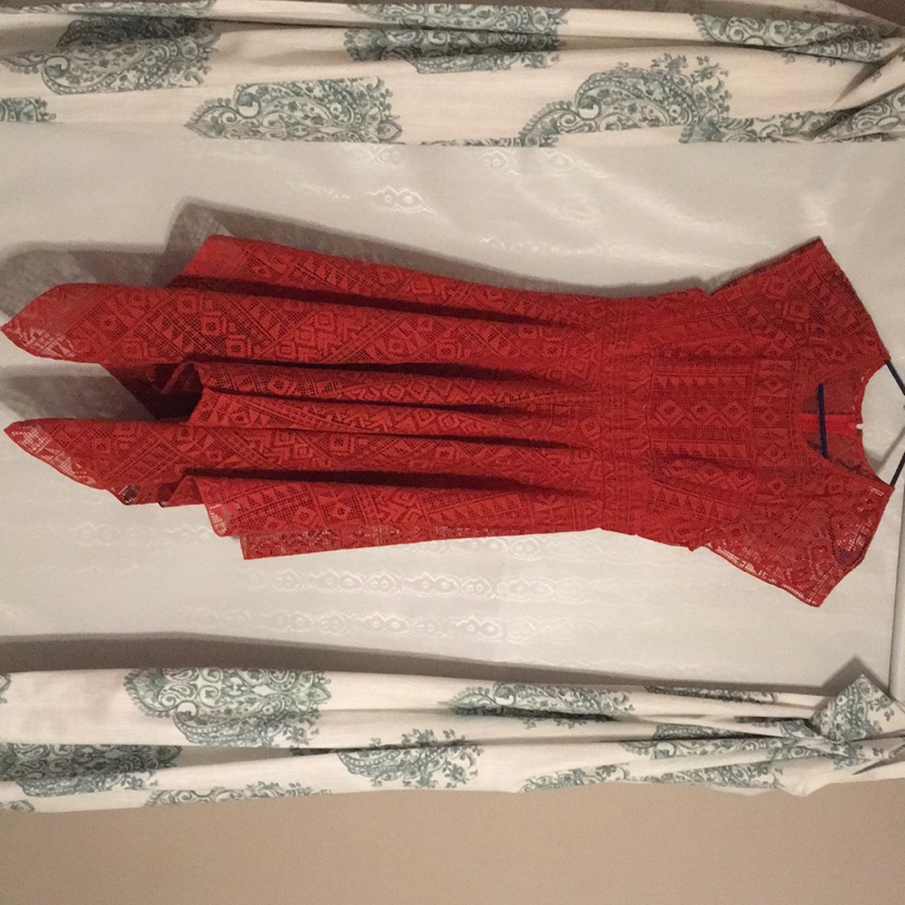 Red asymmetrical eyelet dress